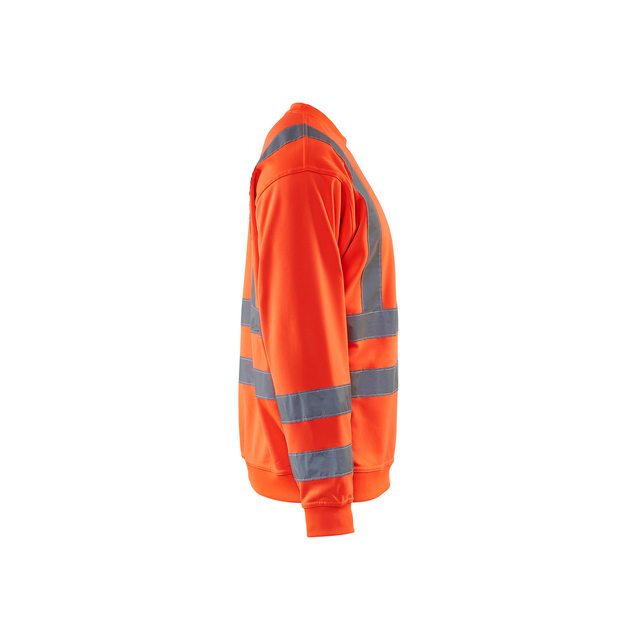 Orange reflexjacka med grå reflexband runt torso och ärmar, sedd från sidan.