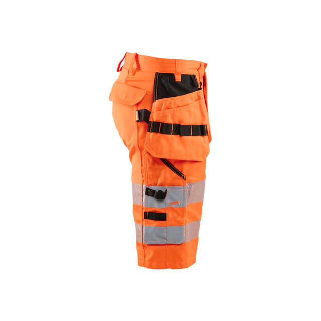 Orange arbetsbyxor med reflexband och flera fickor.