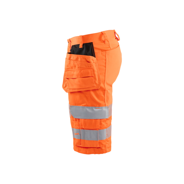 Orange arbetsbyxor med reflexband och praktiska fickor på sidan.
