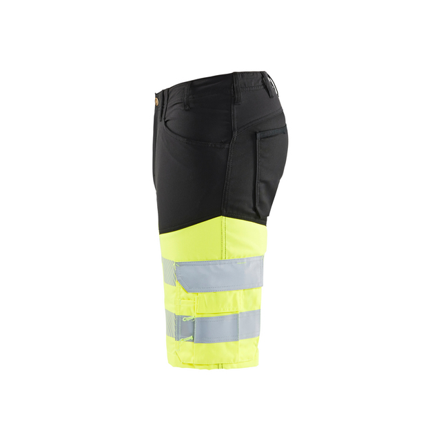 Svart och gul varselshorts med reflexband vid knäet.