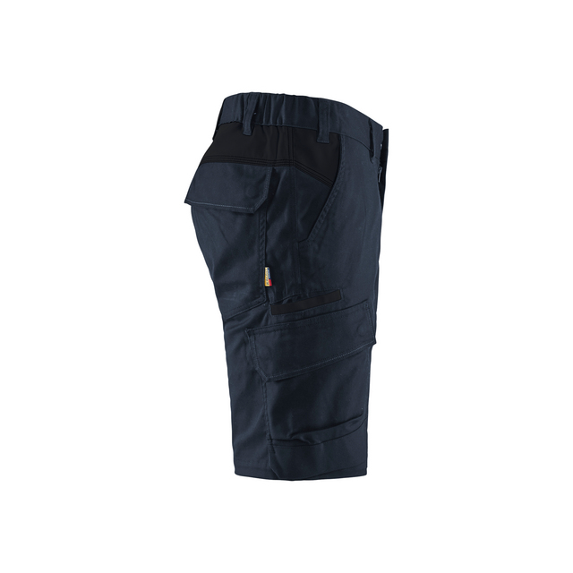 Mörkblå arbetsshorts med flera fickor och elastisk midja, visade från sidan.