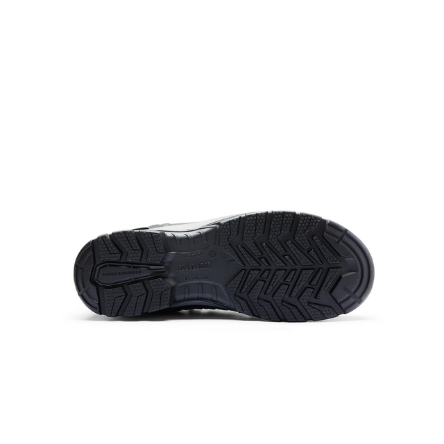 Skosula med grovt mönster och texten Skechers Memory Foam synlig på en del av sulan.