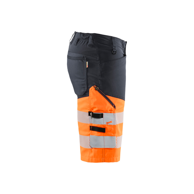 Arbetsbyxa med svart och orange design, reflekterande ränder och flera fickor.