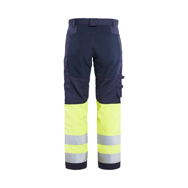 Mörkblå och neongula arbetsbyxor med reflexband vid knäna och flera fickor.