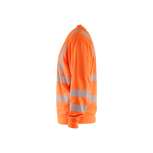 Orange arbetsjacka med silverfärgade reflexband runt armar och midja, sedd från sidan.
