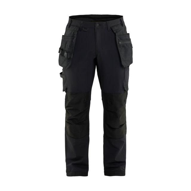 Mörka arbetsbyxor med flera fickor och förstärkta knän.