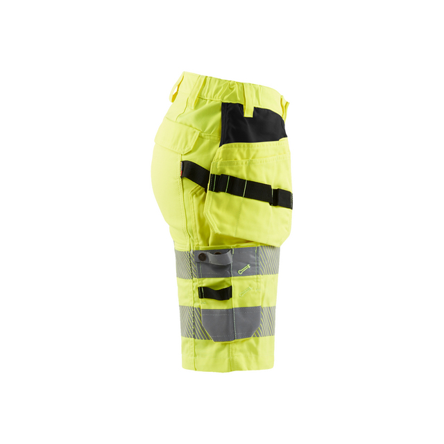 Gula shorts med svarta och grå sektioner samt verktygshållare.
