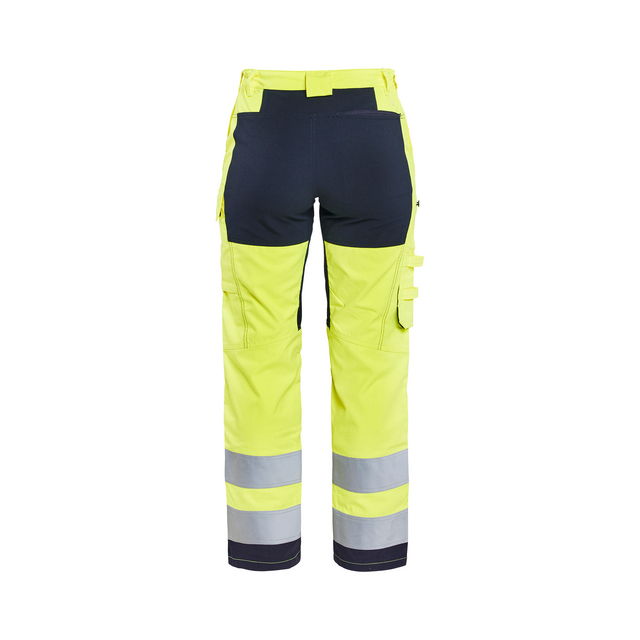 Varselbyxor i gult och svart med reflexband vid benslut, flera fickor och hällor.