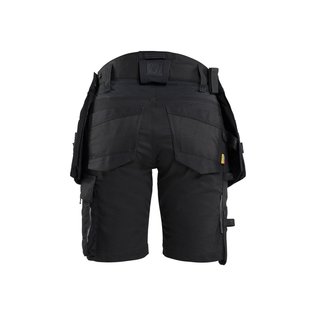 Svarta arbetsshorts med flera fickor och öglor, sedd bakifrån.