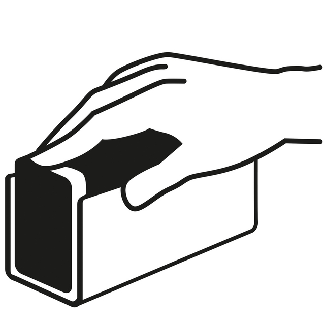 Hand som håller i en rektangulär blockformad föremål.